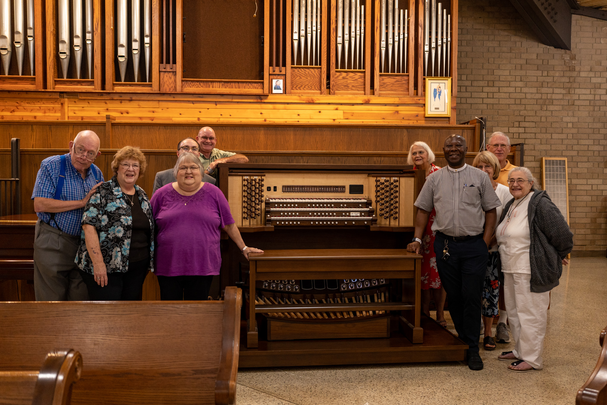 Father Patrick and the other people present together with the new organ